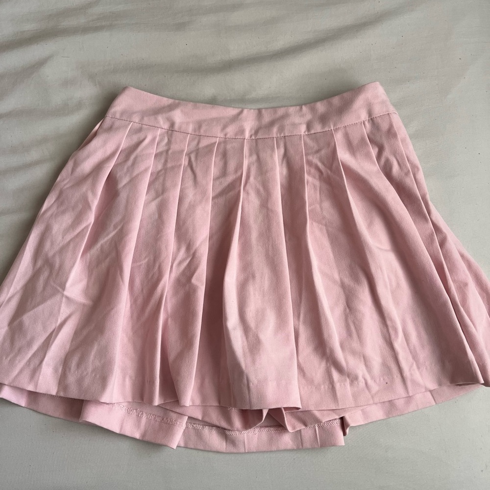 Pleated light pink skirt with built in shorts